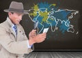 Detective looking through magnifying class with Colorful Map with paint splattered wall background Royalty Free Stock Photo