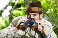 Detective man, search and portrait in jungle with vintage gear for investigation and solution. Outdoor, private