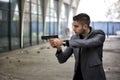 Detective or mobster or policeman aiming a firearm Royalty Free Stock Photo