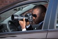 Detective Sitting Inside Car Photographing