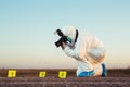 Detective studying a crime scene taking photographs.