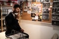 Detective working in his office interior with evidence board on wall, drinking coffee and searching for solution Royalty Free Stock Photo