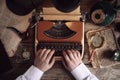 Detective working on vintage typewriter at table, top view Royalty Free Stock Photo