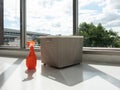 Detergent bottle mock up for clean fabric with clothing basket on the floor indoor with sun light and cloud sky