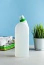 Detergent, disinfectant on a blue background. The concept of cleaning, General cleaning, household chemicals. Copy space