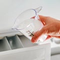 Detergent in dosing cup for laundromat Royalty Free Stock Photo