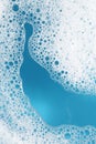 Detergent foam with bubbles on light blue background, top view Royalty Free Stock Photo