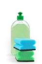 Detergent. Green dishwashing liquid and sponges.