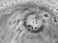 Detergent or soap bubbles and water going down the sink Royalty Free Stock Photo