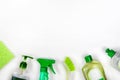 Detergents in green plastic bottles for housekeeping. ÃÂ¡leaning accessories. Top view of cleaning supplies on white background. Royalty Free Stock Photo