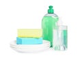 Detergents, plates and sponges on background. Clean dishes Royalty Free Stock Photo