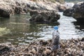 Deteriorated plastic bottle returned by the sea