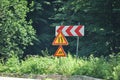 Bend ahead to left. Danger road signs Royalty Free Stock Photo