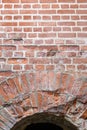 Deterioration in old brick masonry in arched doorway and wall Royalty Free Stock Photo