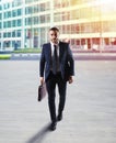 Determinated businessman walking in the city Royalty Free Stock Photo