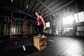 Athletic girl does box jump exercises at the gym Royalty Free Stock Photo