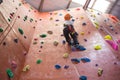 Determined boy practicing rock climbing Royalty Free Stock Photo