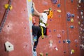 Determined boy practicing rock climbing Royalty Free Stock Photo