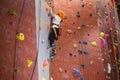 Determined boy practicing rock climbing Royalty Free Stock Photo