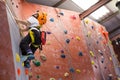 Determined boy practicing rock climbing Royalty Free Stock Photo