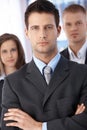 Determined businessman with coworkers