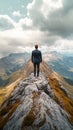 A determined businessman in a suit climbing to the peak of a mountain