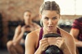 Determined fitness woman doing squat with kettle bell Royalty Free Stock Photo