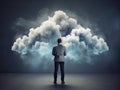 Determined man stands on a level surface, gazing at a 3D cloud, representing the abstract concept of cloud computing.