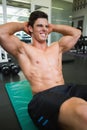 Determined muscular man doing abdominal crunches Royalty Free Stock Photo