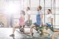 Determined people lifting kettlebells at crossfit gym Royalty Free Stock Photo