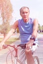 Determined senior man riding bicycle in park Royalty Free Stock Photo