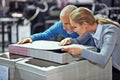 Determined to achieve perfection. two colleagues inspecting inventory in a printing factory.