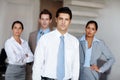 Determined to lead his team to success. A young business leader standing in front of his successful team confidently. Royalty Free Stock Photo