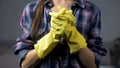 Determined wife in yellow gloves ready to start cleaning household, housekeeping
