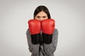 Determined woman with boxing gloves ready to fight Royalty Free Stock Photo