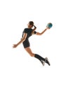 Determined woman, handball player in action, exhibiting focus and energy during training against white background