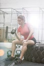 Determined woman lifting kettlebell in crossfit gym Royalty Free Stock Photo