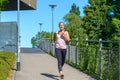 Determined woman smiling happy while jogging Royalty Free Stock Photo