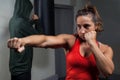 Determined women practicing boxing