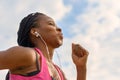 Determined young African woman working out jogging Royalty Free Stock Photo