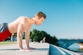 Fit Caucasian Man Doing Pushups During An Early Morning Workout