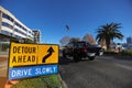 Detour drive slowly ahead safety warning sign applying on public busy residential areas