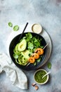 Detox Buddha bowl with avocado, spinach, greens, zucchini noodles, grilled shrimps and pesto sauce. Royalty Free Stock Photo