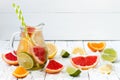 Detox citrus infused flavored water. Refreshing summer homemade cocktail with lemon, lime, orange and grapefruit. Clean eating
