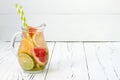 Detox citrus infused flavored water. Refreshing summer homemade cocktail with lemon, lime, orange and grapefruit. Copy space backg Royalty Free Stock Photo