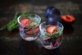 Detox drink with mineral water, plums and thyme Royalty Free Stock Photo
