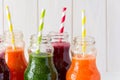 Detox drinks in bottles: fresh smoothies from vegetables: beet, carrot, spinach, cucumber and apple Royalty Free Stock Photo