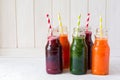 Detox drinks in bottles: fresh smoothies from vegetables: beet, carrot, spinach, cucumber and apple Royalty Free Stock Photo