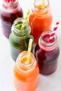 Detox drinks in bottles: fresh smoothies from vegetables: beet, carrot, spinach, cucumber and apple Royalty Free Stock Photo