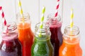 Detox drinks in bottles: fresh smoothies from vegetables: beet, carrot, spinach, cucumber and apple Royalty Free Stock Photo